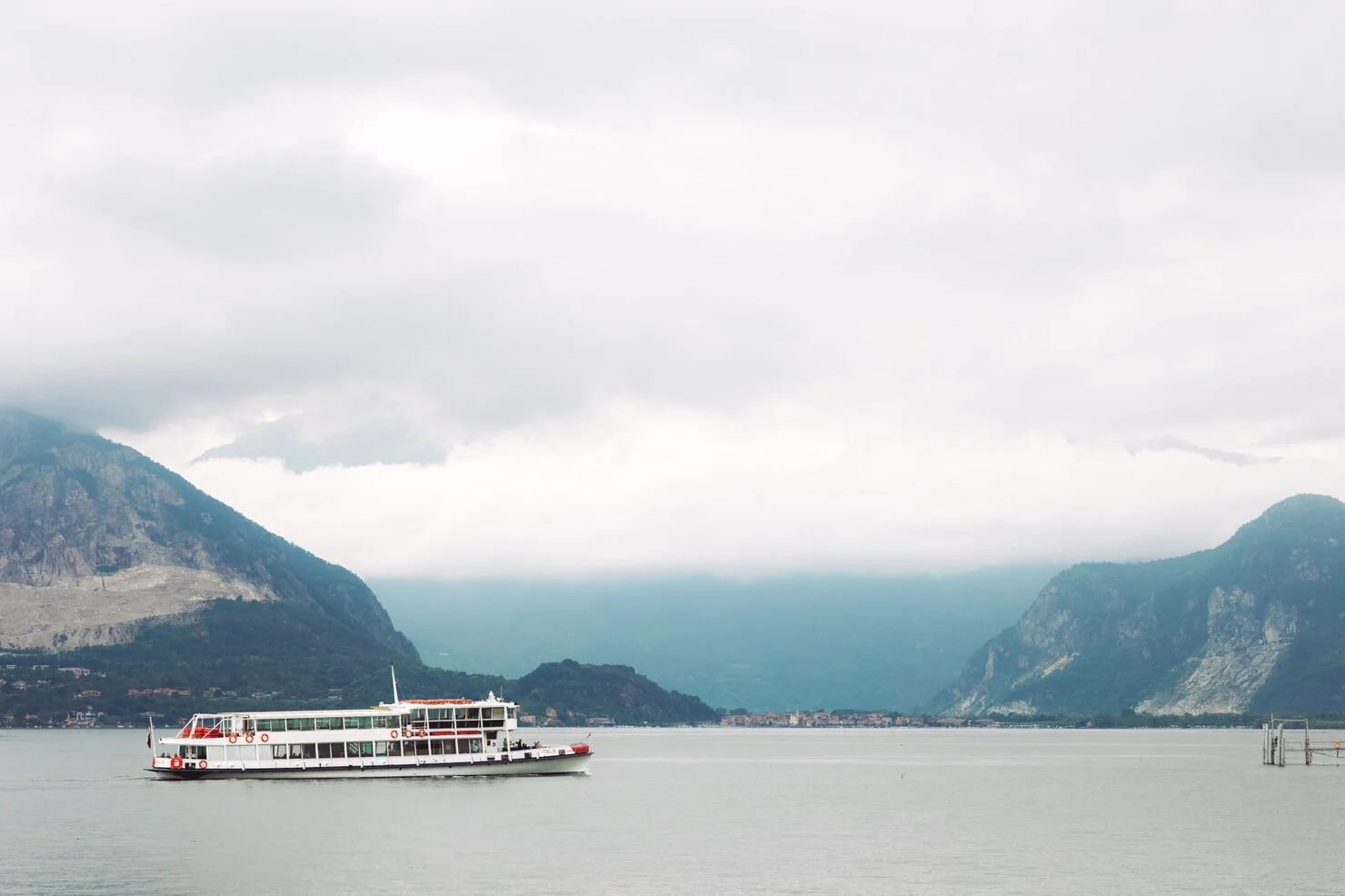 lonely-white-boat-stands-sea-before-mountains_8353-9009